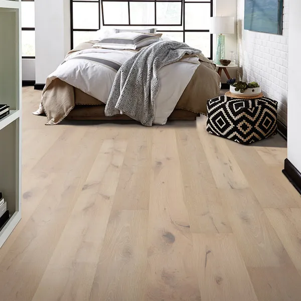 Bedroom scene - Light colored wood-look flooring.