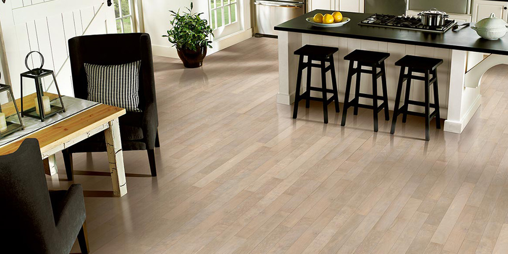 Kitchen dining scene with laminate flooring.