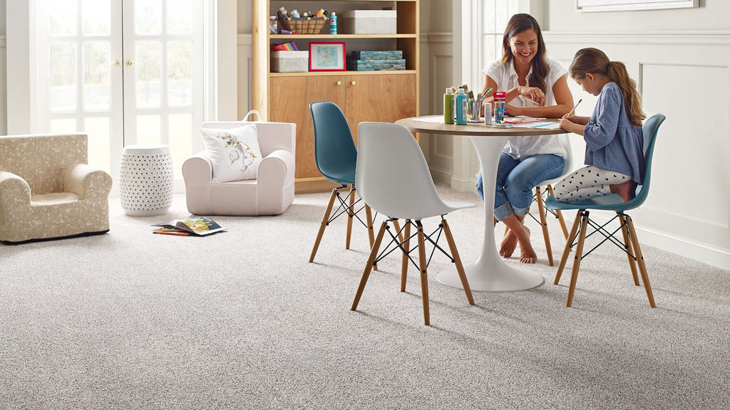 Living room scene with furniture and carpet.