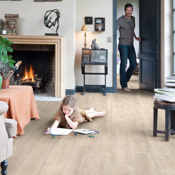 Living room scene with blonde wood flooring